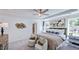 Serene main bedroom with tray ceilings, a sitting area, and generous natural light at 664 Morning Glade St, Wake Forest, NC 27587