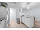Open concept kitchen with island and stainless steel appliances at 7002 Longstreet Dr # C, Raleigh, NC 27615