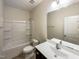 Bathroom with a shower/tub combo, vanity, and built-in shelving at 7434 Randshire Way, Raleigh, NC 27616