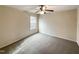 Well-lit bedroom, featuring a ceiling fan and carpet at 7434 Randshire Way, Raleigh, NC 27616