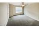 Simple bedroom with window, ceiling fan and carpet at 7434 Randshire Way, Raleigh, NC 27616