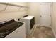 Laundry room with washer, dryer, and shelving at 7434 Randshire Way, Raleigh, NC 27616