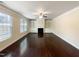 Spacious living room with hardwood floors and a fireplace at 7434 Randshire Way, Raleigh, NC 27616
