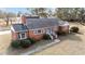 Aerial view of the brick ranch house and yard at 809 Jeffreys Rd, Rocky Mount, NC 27804
