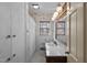 Clean bathroom with marble vanity and floral wallpaper at 809 Jeffreys Rd, Rocky Mount, NC 27804