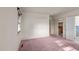 Bright bedroom featuring carpet, ample closet space and door to bathroom at 809 Jeffreys Rd, Rocky Mount, NC 27804