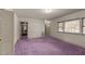 Bright bedroom with purple carpet and ample natural light at 809 Jeffreys Rd, Rocky Mount, NC 27804