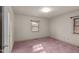 Spacious bedroom with carpeted floors and large windows at 809 Jeffreys Rd, Rocky Mount, NC 27804