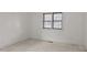 Well-lit bedroom with neutral walls and carpet at 809 Jeffreys Rd, Rocky Mount, NC 27804