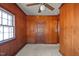Simple bedroom with wood paneling and carpet at 809 Jeffreys Rd, Rocky Mount, NC 27804