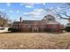 Brick ranch house with a spacious lawn and mature trees at 809 Jeffreys Rd, Rocky Mount, NC 27804