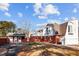 Home's exterior showcasing brick and a unique barn-style addition at 809 Jeffreys Rd, Rocky Mount, NC 27804