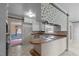 Kitchen with breakfast bar and views into dining area at 809 Jeffreys Rd, Rocky Mount, NC 27804