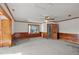 Large main bedroom with wood paneling and ceiling fan at 809 Jeffreys Rd, Rocky Mount, NC 27804