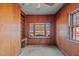 Wood-paneled office with built-in shelving and window seat at 809 Jeffreys Rd, Rocky Mount, NC 27804