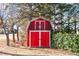 Red barn-style storage building with double doors at 809 Jeffreys Rd, Rocky Mount, NC 27804
