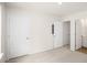 Well-lit bedroom with two doors and carpet flooring at 8611 Brixton Shay Dr, Raleigh, NC 27616
