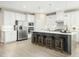 Bright kitchen featuring white cabinets, stainless steel appliances, and a large center island with seating at 8817 Tartan Clan Dr, Angier, NC 27592