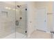 Bathroom with a large glass shower and tile floor at 104 Barn Door Dr, Lillington, NC 27546