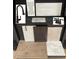 Bathroom features: Modern faucets, hexagonal and large-format wall tiles, and granite countertop at 104 Barn Door Dr, Lillington, NC 27546