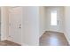 Light-colored foyer with wood-look flooring and two doors at 104 Barn Door Dr, Lillington, NC 27546
