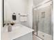 Bright bathroom featuring a large vanity area, quartz countertop, and a glass enclosed shower at 107 Ailey Brook Way # 200, Wake Forest, NC 27587