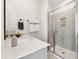 Bathroom featuring a glass shower and quartz countertops with white shaker cabinets at 107 Ailey Brook Way # 200, Wake Forest, NC 27587