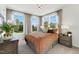 Inviting bedroom featuring a comfortable bed, large windows with natural light, and elegant décor at 107 Ailey Brook Way # 200, Wake Forest, NC 27587