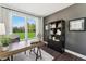 Home office space with an outside view, a modern desk, chair, and stylish decor at 107 Ailey Brook Way # 200, Wake Forest, NC 27587