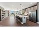 Open-concept kitchen featuring an oversized island, modern cabinetry, and stainless steel appliances at 107 Ailey Brook Way # 200, Wake Forest, NC 27587