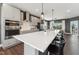 Modern kitchen featuring stainless steel appliances, sleek cabinetry, and a large kitchen island at 107 Ailey Brook Way # 200, Wake Forest, NC 27587