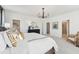 Bright main bedroom featuring neutral tones, a chandelier, and a doorway leading to the en suite bathroom at 107 Ailey Brook Way # 200, Wake Forest, NC 27587