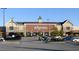 A Wegmans store with brick facade, steeple detail and extensive parking at 107 Ailey Brook Way # 200, Wake Forest, NC 27587