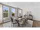 Bright dining room featuring a wooden table, stylish chairs, and large windows for natural light and a decorative rug at 109 Ailey Brook Way # 200, Wake Forest, NC 27587
