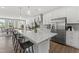 Bright kitchen with a large center island, modern appliances, and wood-look flooring at 109 Ailey Brook Way # 200, Wake Forest, NC 27587