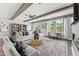 Cozy living room featuring hardwood floors, exposed beams, and large windows with natural light at 109 Ailey Brook Way # 200, Wake Forest, NC 27587