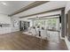 Open-concept living room with hardwood floors, exposed beams, and comfortable seating at 109 Ailey Brook Way # 200, Wake Forest, NC 27587