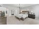 Serene main bedroom with soft carpet, decorative wall art, a chandelier, and a comfortable bed with stylish pillows at 109 Ailey Brook Way # 200, Wake Forest, NC 27587
