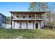 White two-story house with a large deck and yard at 1128 E Geer St, Durham, NC 27704