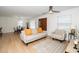 Light-filled living room with hardwood floors, and neutral colored furniture at 1128 E Geer St, Durham, NC 27704