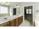 Primary bathroom vanity with double sinks and a large mirror at 1201 Rivermead Ln, Wake Forest, NC 27587