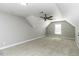 Large bedroom with plush carpet, ceiling fan, and natural light from windows at 1201 Rivermead Ln, Wake Forest, NC 27587