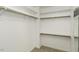 Organized closet with white shelving and rod for ample storage and well-maintained carpeted floor at 1201 Rivermead Ln, Wake Forest, NC 27587