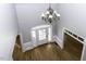 High angle view of foyer featuring hardwood floors and a chandelier with natural light at 1201 Rivermead Ln, Wake Forest, NC 27587