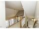 The upstairs hallway offers a view of the home's architecture with wooden railings and natural light at 1201 Rivermead Ln, Wake Forest, NC 27587