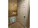 Hallway with six-panel door, a hanging chandelier and staircase views at 1201 Rivermead Ln, Wake Forest, NC 27587