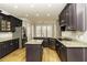 Spacious kitchen boasting a large island, stainless steel appliances, and granite countertops at 1201 Rivermead Ln, Wake Forest, NC 27587