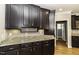 Kitchen featuring granite countertops, dark wood cabinets, and stainless steel appliances at 1201 Rivermead Ln, Wake Forest, NC 27587