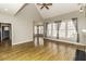 Bright living room with vaulted ceilings and a large window overlooking the backyard at 1201 Rivermead Ln, Wake Forest, NC 27587
