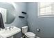 Cozy powder room with pedestal sink and stylish mirror at 1201 Rivermead Ln, Wake Forest, NC 27587